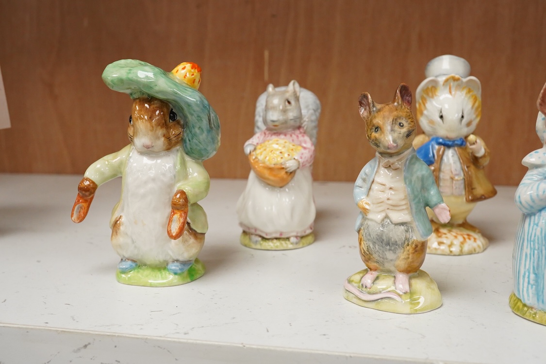 A collection of thirteen Beatrix Potter character figures, stamped with a gold stamp F Warn and Co Ltd, Beswick England, largest 12cm high